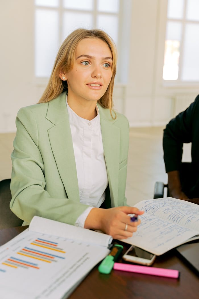 Offerings 1 female professional on a mint green blazer 5466244